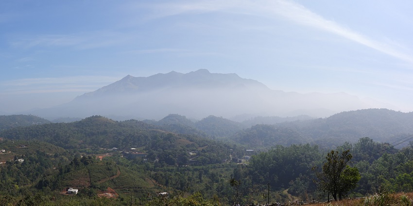 Enjoy the panoramic views from the Chembra Peak, a must-visit near Meenmutty Waterfalls.