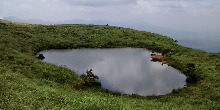 Heart shaped lake at Chembra peak - one of the most adventurous places to visit in Wayanad