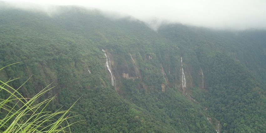 Lush green mountains and waterfalls in Cherrapunji - places to visit in summer in India