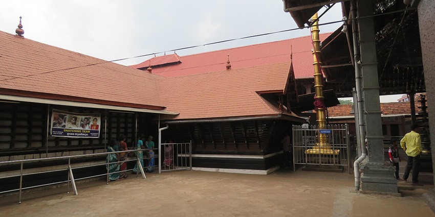 Chottanikkara Bhagavathy Temple with traditional Kerala architecture surrounded by devotees.