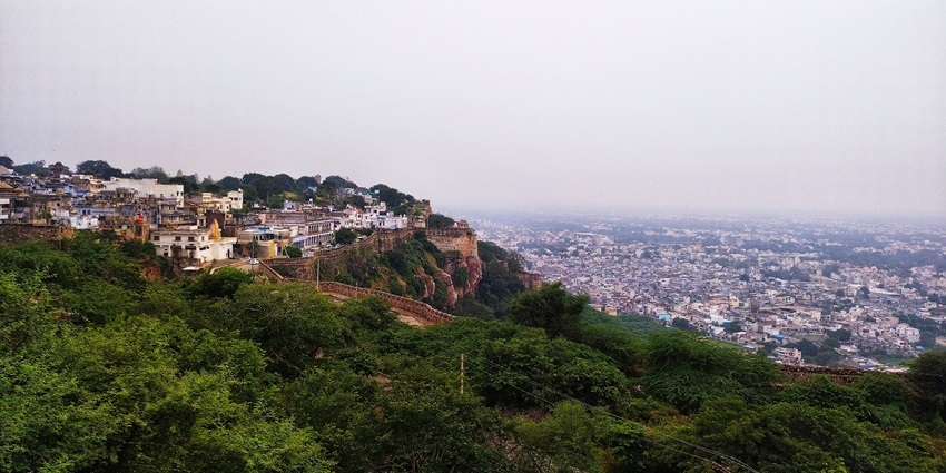 a view of a city from the top of a hill