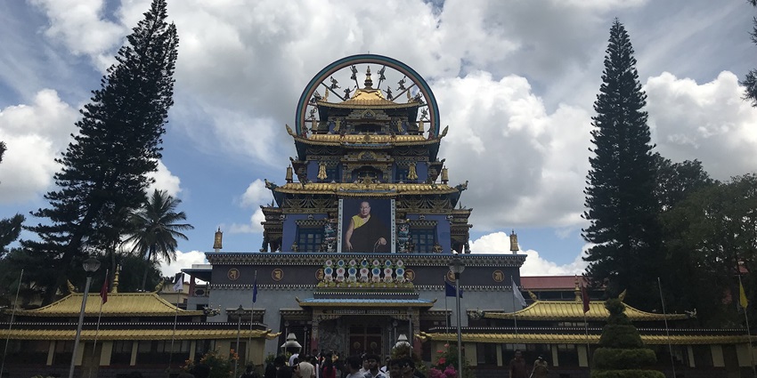 Golden Temple in Coorg with ornate Tibetan architecture and vibrant monastery surroundings.