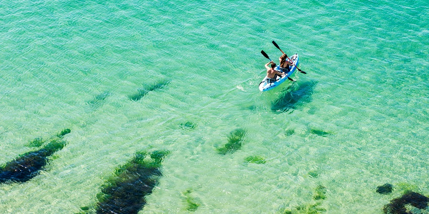 One of the best things to do in Andaman in December is kayaking on the cobalt blue waters.