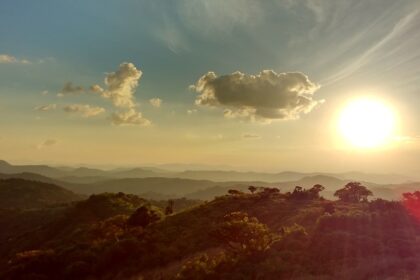 A stunning view of Mathikettan Shola Park in Kerala during sunset covered with dense clouds.