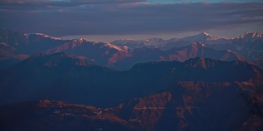Sunset hues sparkling on the snow covered peaks of Dalhousie, offering a mesmerising view