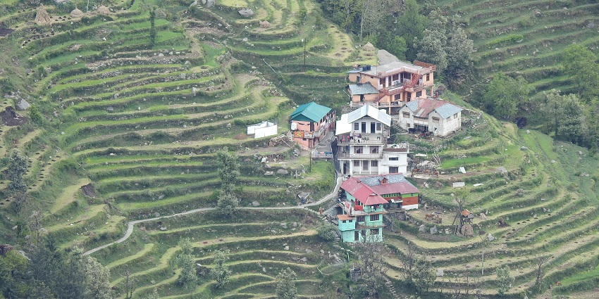 Habitation on the way to Dalhousie surrounded by lush green - hill stations near Udhampur