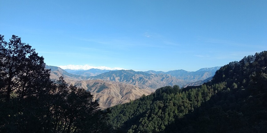 View of Dehradun peaks covered in snow - places to visit in India in June with family