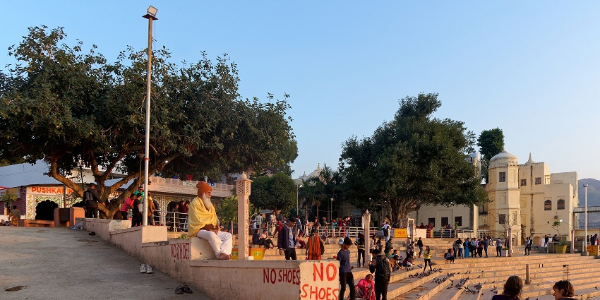 A picture of a ghat in Udhampur with devotees arriving to offer prayers at the riverside