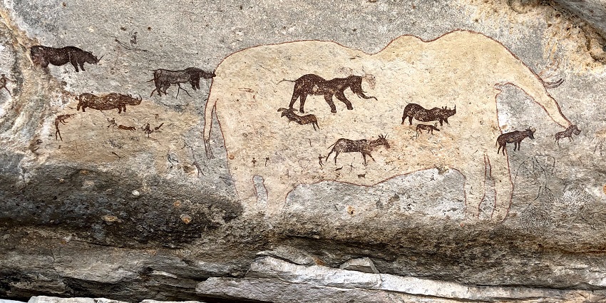 Explore the prehistoric rock paintings near the Dolmens cave near Thoovanam Falls