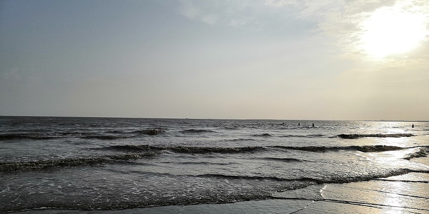 A scenic shot of the glistening waves of the haunted Dumas Beach in Surat, Gujarat