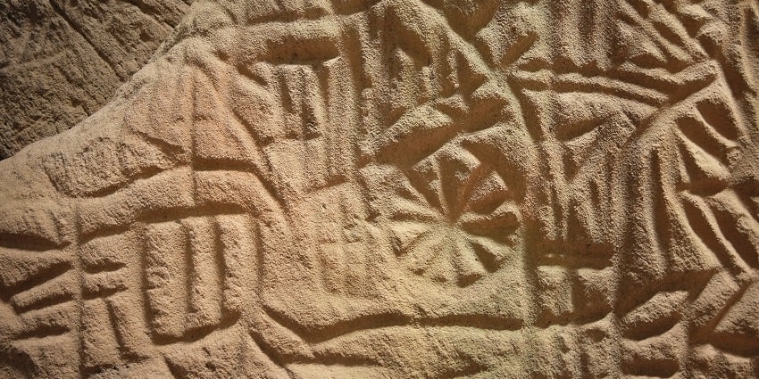A view of intricate and ancient engravings in Edakkal Caves you can explore in Wayanad.