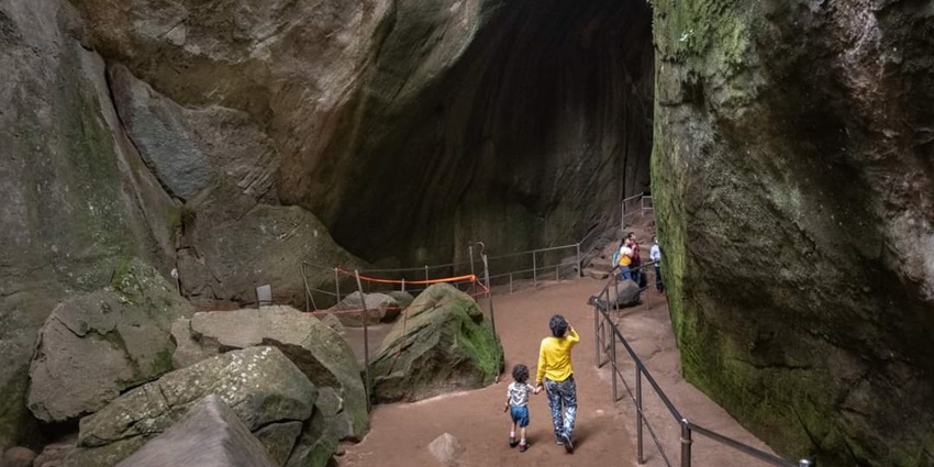 These caves have various etchings, carvings, and prehistoric line drawings on their walls.