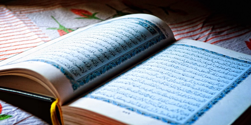 Explore the history and role of the Malik Deenar Mosque in promoting religious harmony.