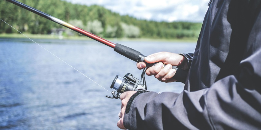 Image of a person fishing around the waterfalls lake - things to do at the waterfalls