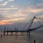 The fishing nets at Kochi during the sunset makes for a picturesque and scenic view