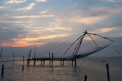 The fishing nets at Kochi during the sunset makes for a picturesque and scenic view