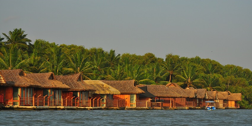 Floating huts on Kerala backwaters, offering a unique and scenic water living experience.
