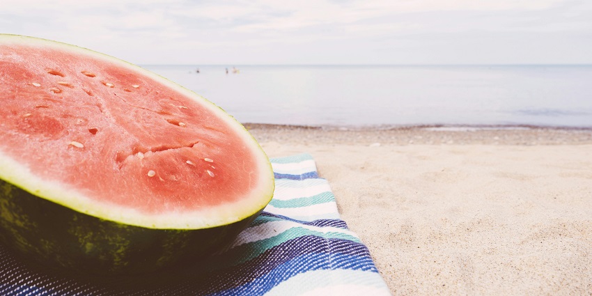 A piece of sliced watermelon on the seashore. Options to eat in Rutland Island.
