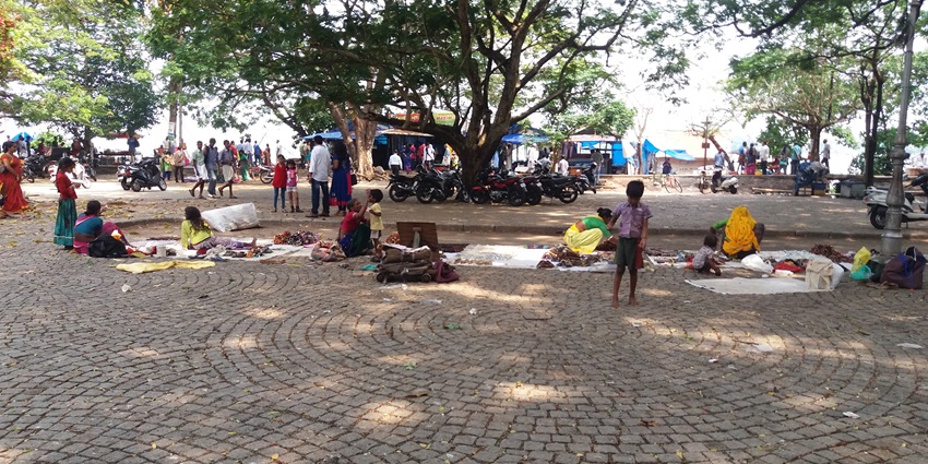 View of people sitting in an open space in the vicinity of the popular Fort Kochi in Kerala