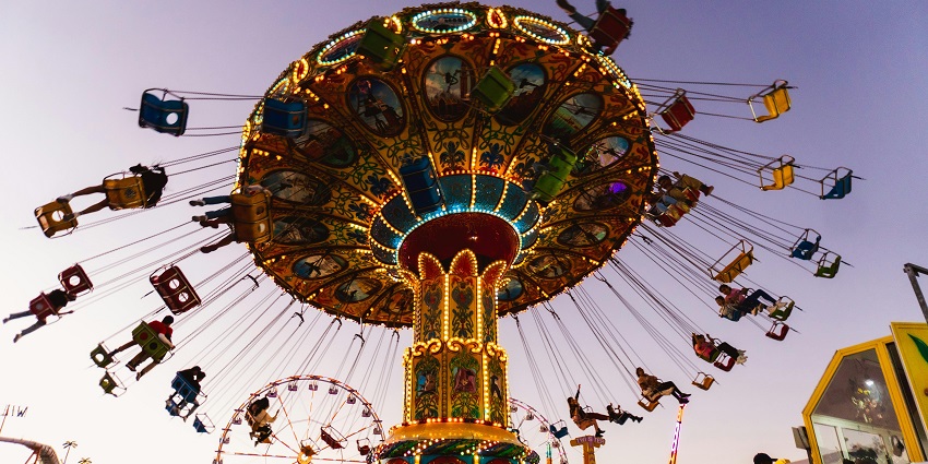 Adventurous view of people on a carousel swing, which is one of the most thrilling rides.