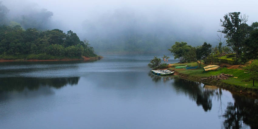 Relax by the serene waters of Gavi, a tranquil spot near Periyar National Park, Kerala.