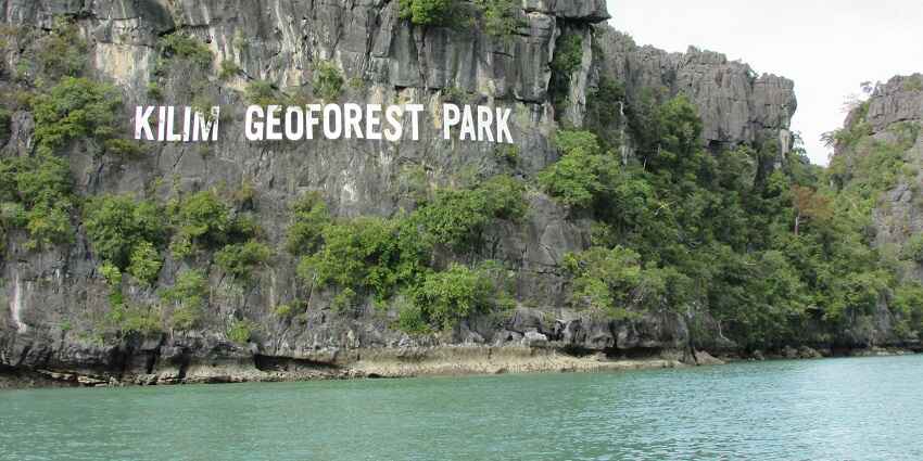 Kilim Karst Geoforest Park with dramatic limestone formations, mangroves, and wildlife.