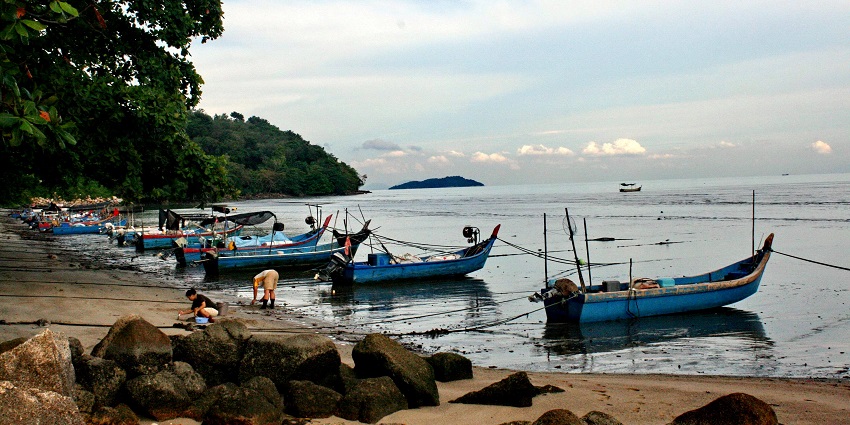 The view of fishing boats at Gertak Sanggul, one of the Penang Beaches, Malaysia.