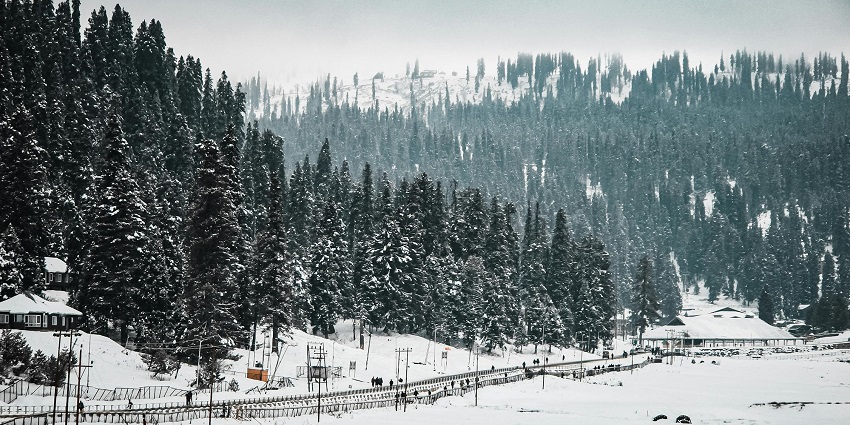 Aerial view of September in Gulmarg: lush meadows, snow-capped peaks, and Gulmarg Gondola