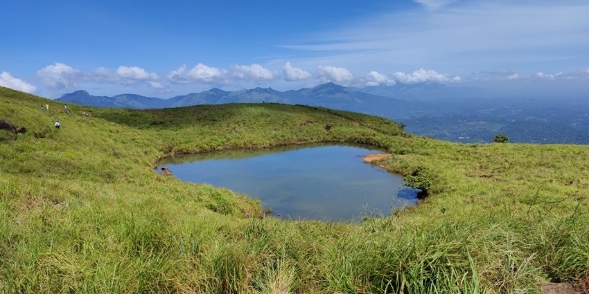 Heart shaped lake amidst the verdant fields of Chembra peak at Wayanad hill station