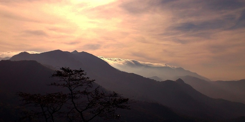 Vibrant dawn hues in the hills of Pondudi - tranquil hill station in Thiruvananthapuram