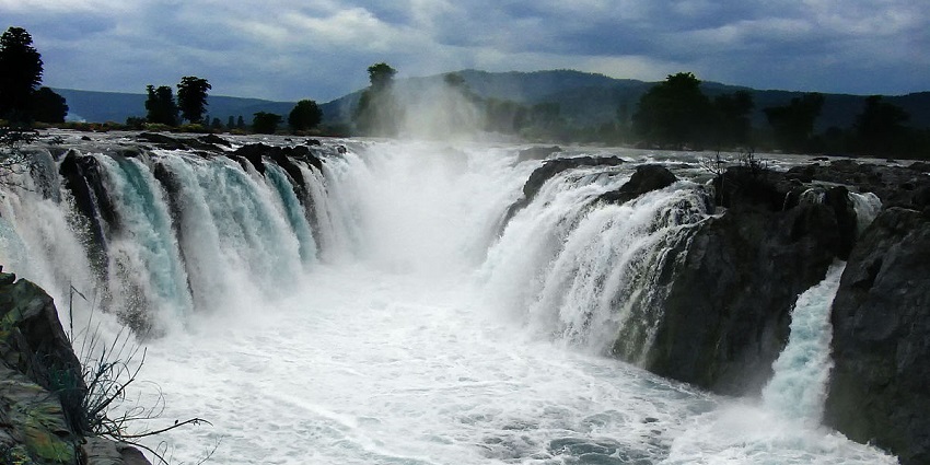 The view of impressive Hogenakkal Falls, with multiple streams falling over rocky terrain.