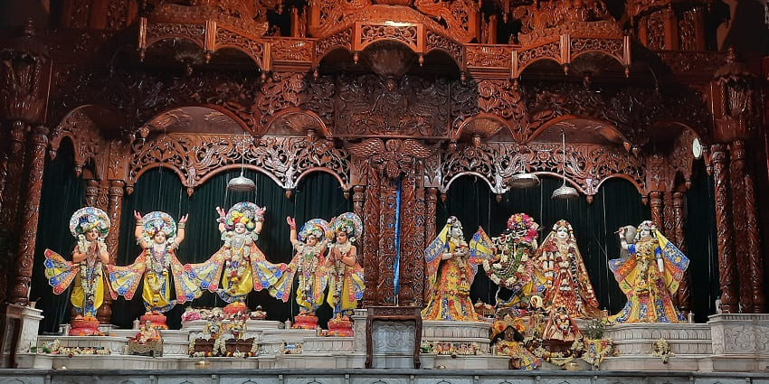 A picture of the inner prayer sanctum of a Lord Krishna temple in Srinagar with idols of various deities