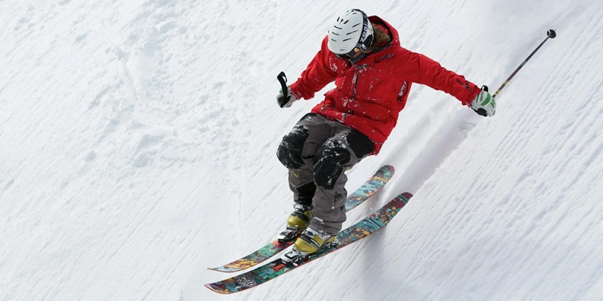 Man in Red Jacket Playing Ice Skates - one of the best things to do in Manali in January