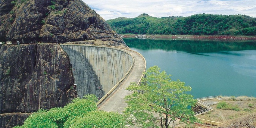 Scenic views from the top of Idukki Arch dam overlooking the hills and dense forest beyond