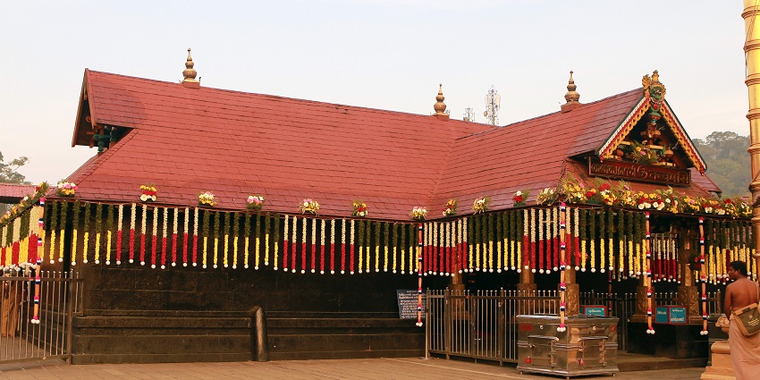 Sabarimala Temple, set amidst forested hills with its distinctive architectural features.