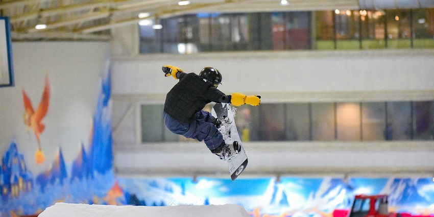 Man jumping with a snowboard - Snow fantasy is one of the best theme parks in Kerala.