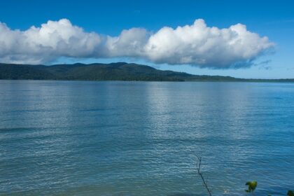 A beautiful view of clear blue water and mesmerising clouds in Rutland Island.