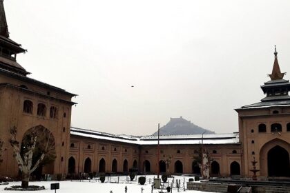 A serene view of the Jamia Masjid with its lofty entrance in the backdrop of winter.