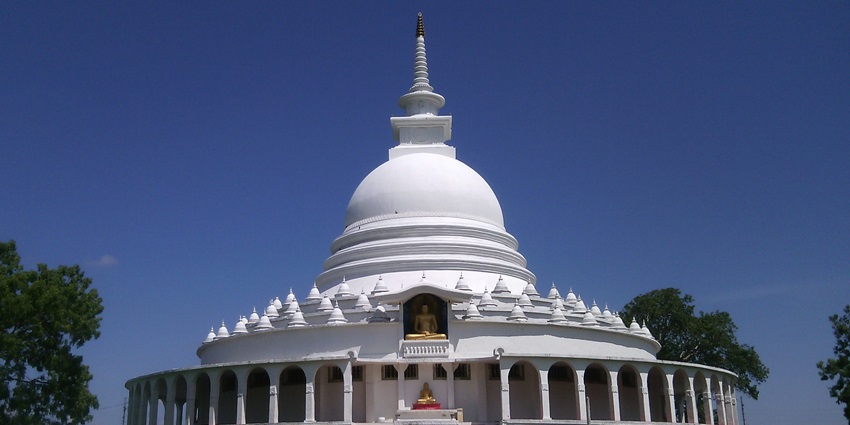 This is a magnificent white peace pagoda built over a hill in Darjeeling.