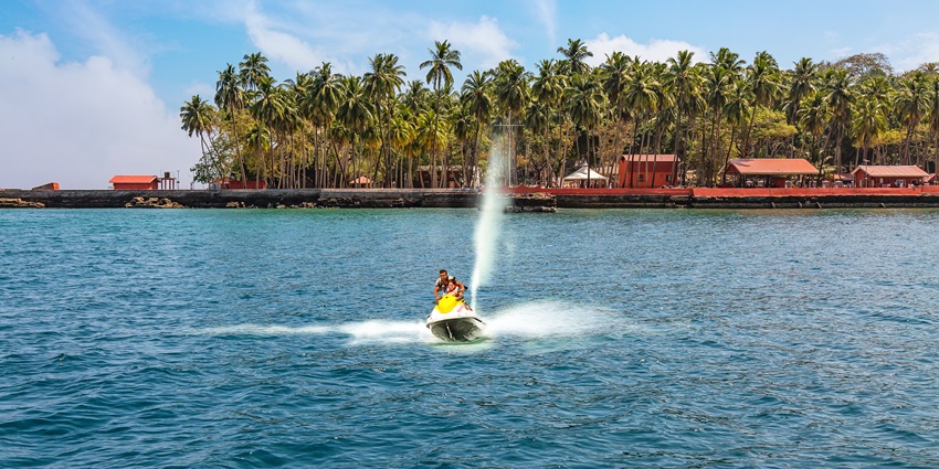 A woman jet skiing across the water. Corbyn’s Cove Beach is famous for jet skiing