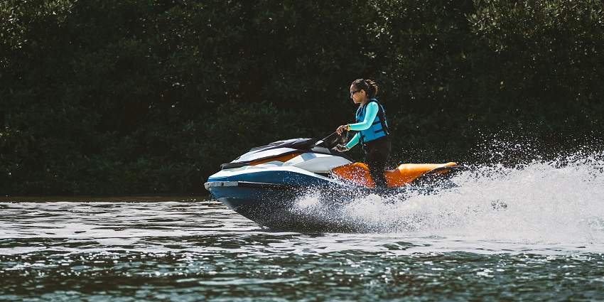 Jet skiing near coastline with clear blue waters - one of the best water sports in Kerala