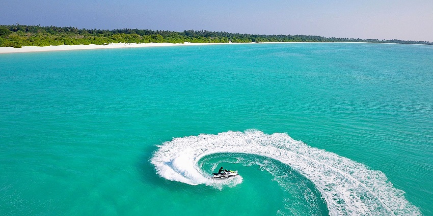 Aerial picture of someone jet skiing - Water sports in Varkala, Kerala