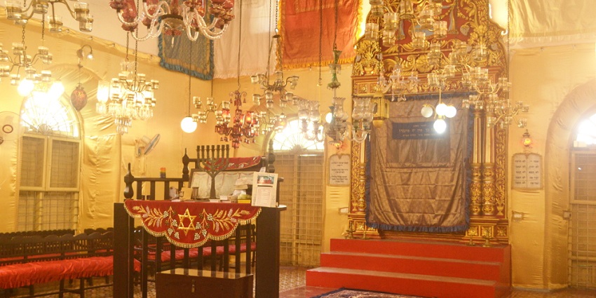 A picture of the interiors of a historical building with a well-lit ambience and traditional decor