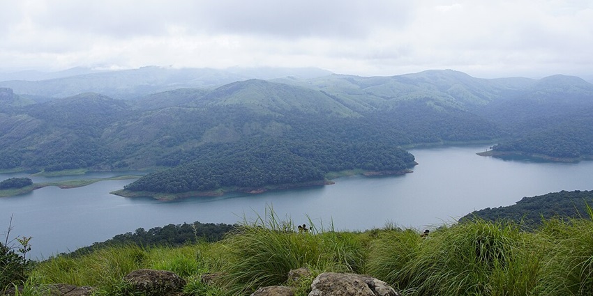 An enchanting view of Kalvari Mount in Kerala with thick green hills all around it.