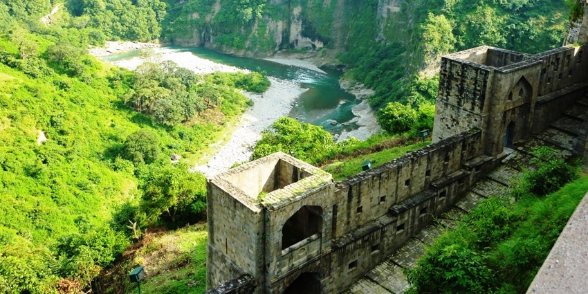 A beautiful view of lush green valleys and flowing river from the top of Kangra Fort