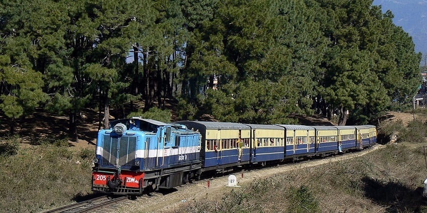 Kangra Valley Train: scenic journey through lush valleys and picturesque hills.