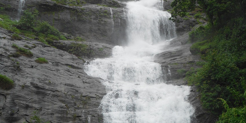 A mesmerising view of Kanjirakolly Waterfalls in Kerala, which is a must-visit attraction.