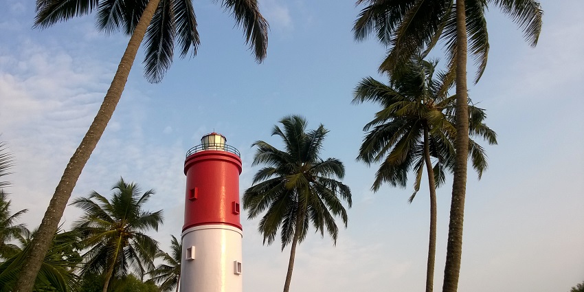 View of the blue skies, palm trees and the Kannur lighthouse making an ideal coastal sight