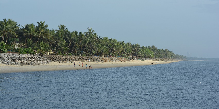 Historic Kappad Beach with golden sands and calm waters, known for its scenic beauty.