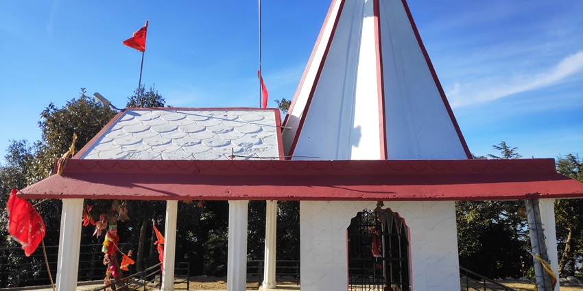 Karol Tibba Kali temple on the hill with the clear blue sky in the background